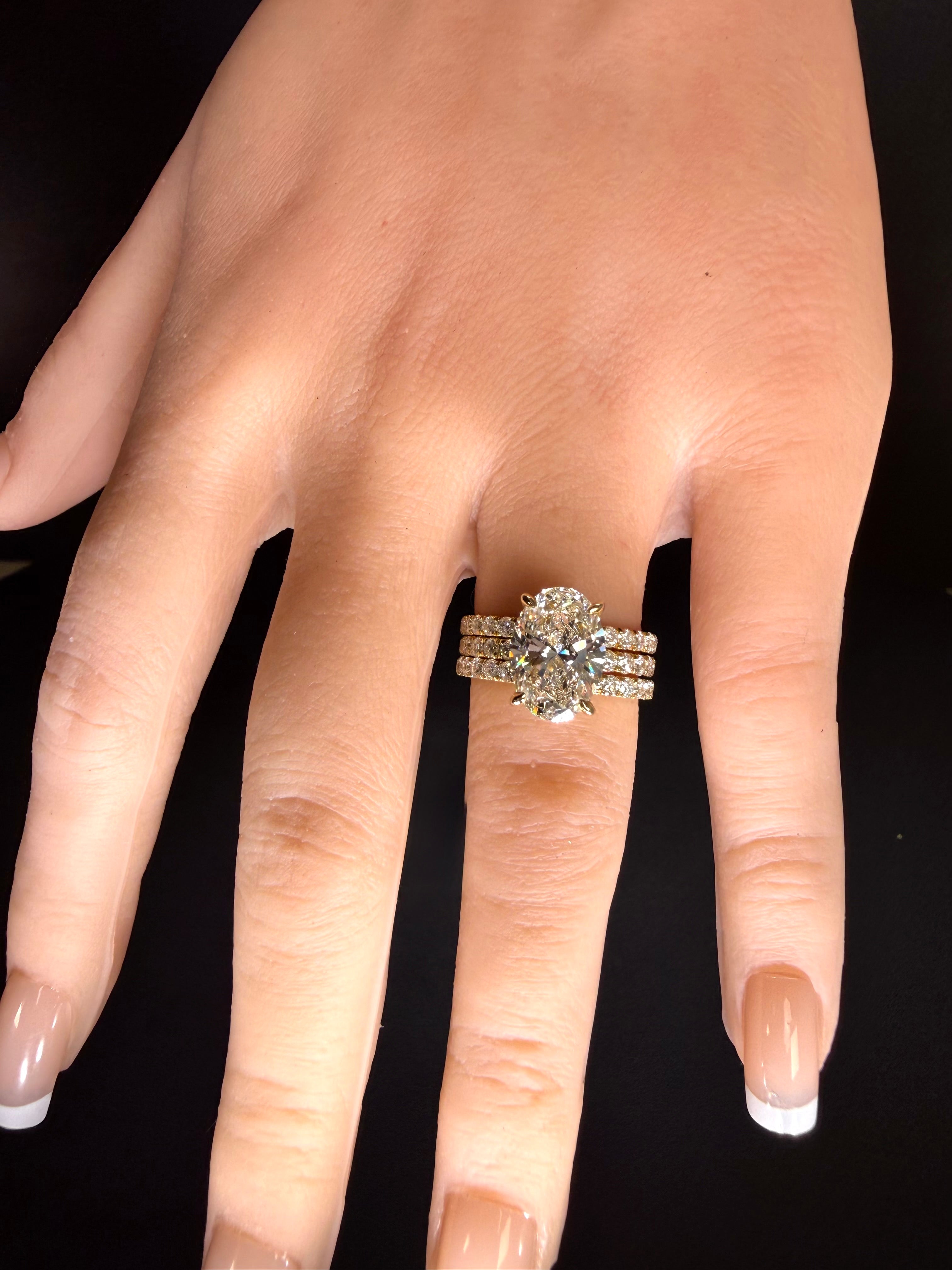 5.06 CTTW Oval Cut Diamond IGI Certified 14K Yellow Gold Engagement Ring