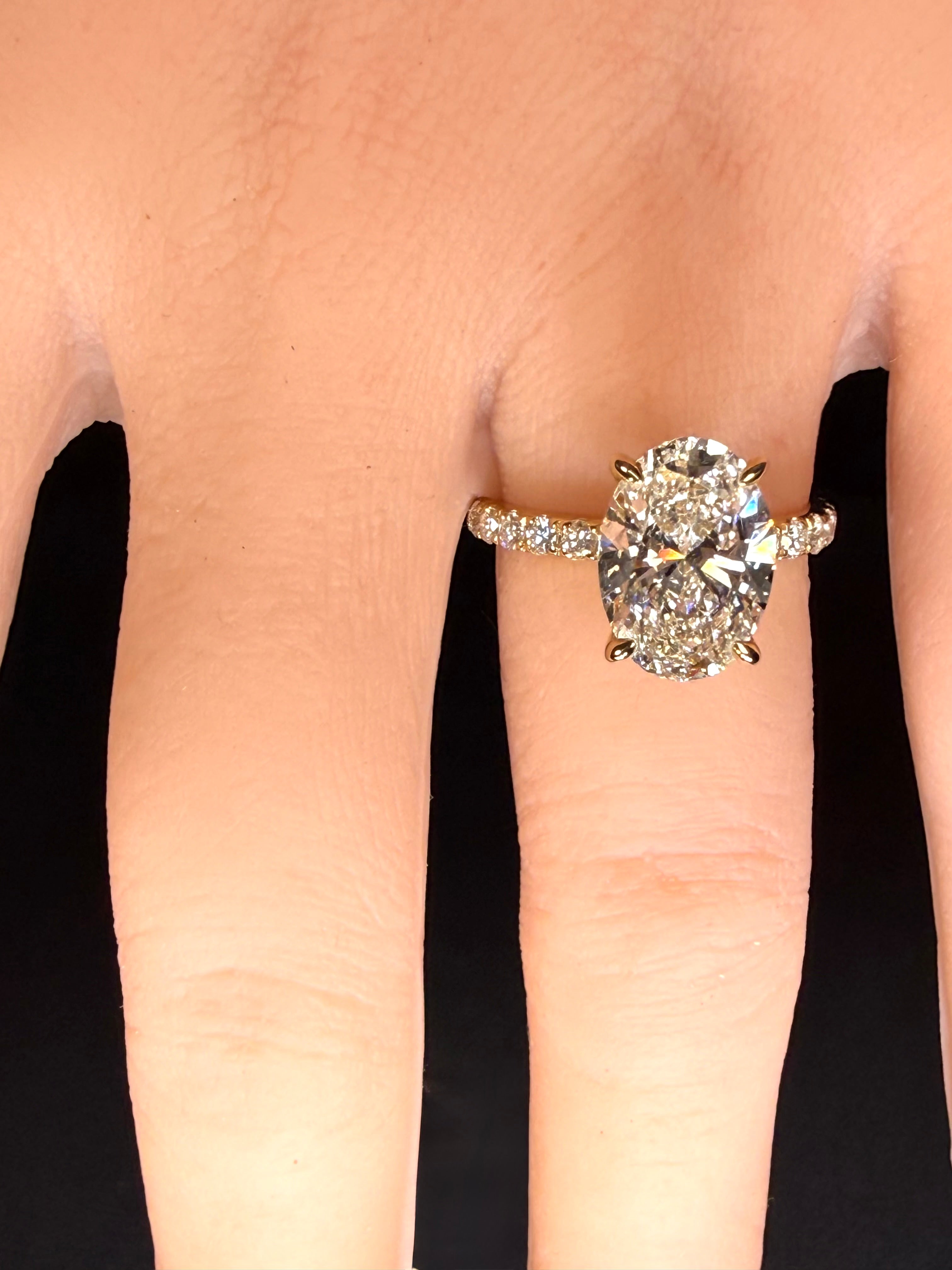 5.06 CTTW Oval Cut Diamond IGI Certified 14K Yellow Gold Engagement Ring